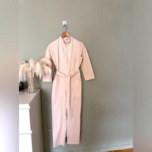 One piece Jumper with belt.